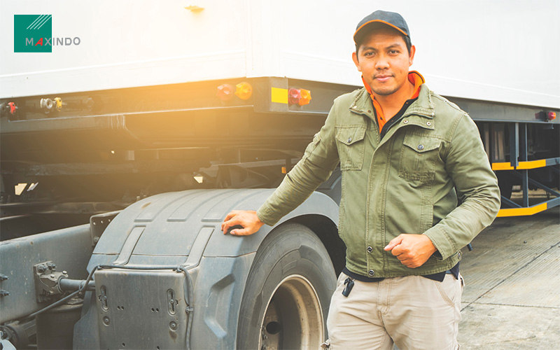 man standing beside his truck